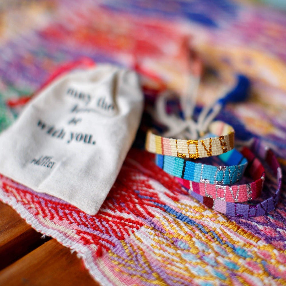 A stack of Atitlan LOVE Bracelets