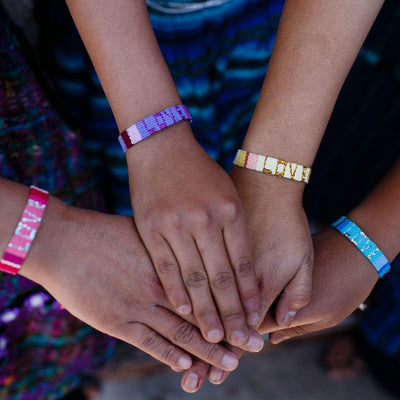 Artisans wearing the Atitlan LOVE Bracelets from Love Is Project