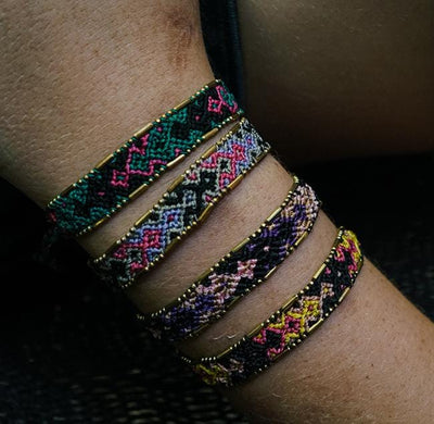A model wearing the Galaxy Bali Friendship Bracelet Bundle from Love Is Project